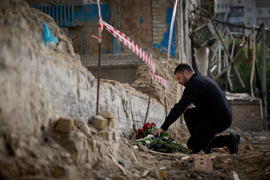 Ukraine's President Zelenskiy pays tribute to victms of a recent Russian drone and missile attack in Kyiv